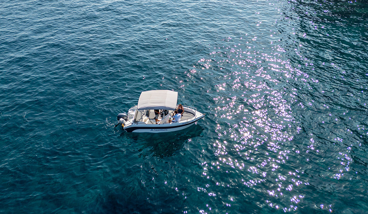 Private boat celebration in Santorini for a romantic proposal, anniversary, or birthday surprise at sea